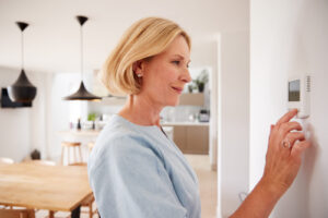 woman checking air conditioner