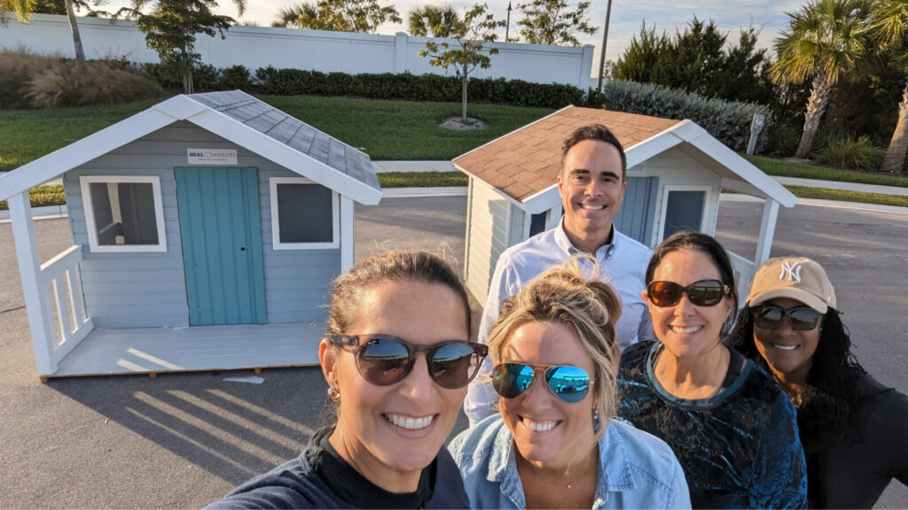 Neal Communities and Neal Signature Homes Employees Paint Playhouses for Habitat for Humanity South Sarasota County’s Cottages for Kids Program