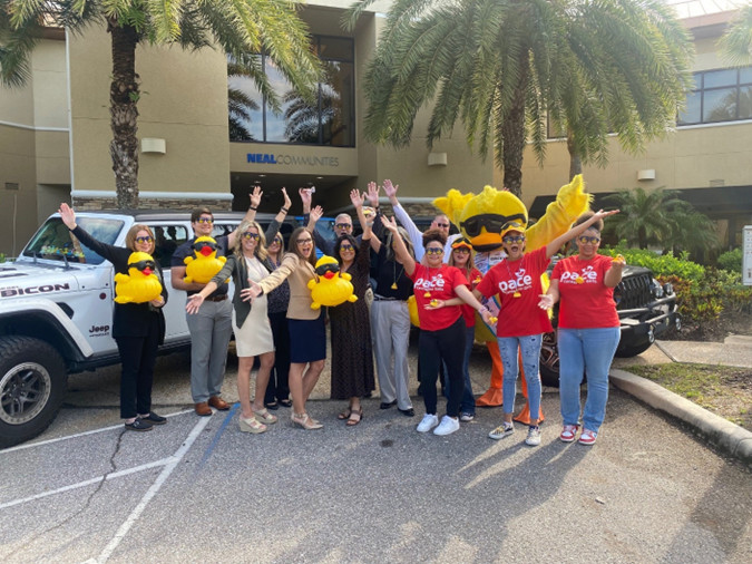 Quacky visits Neal Communities in Preparation for the 15th Annual Lucky Ducky Race for Pace to Benefit Pace Center for Girls of Manatee County